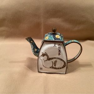 Kelvin Chen?  Painted enamel teapot. 4 inches wide,multicolored